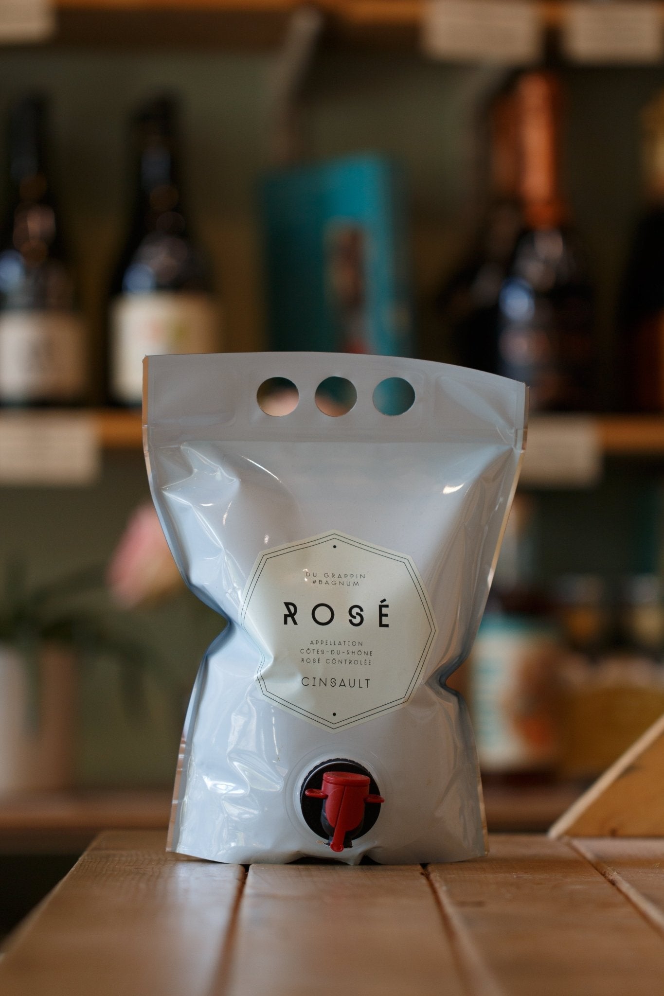 Bagnum Rosé Du Grappin 1.5L - Eco-Friendly Organic Cinsault Wine from Rhône, France, NV displayed in a modern bag, showcasing its unique packaging and vibrant design, ideal for easy and eco-conscious enjoyment.