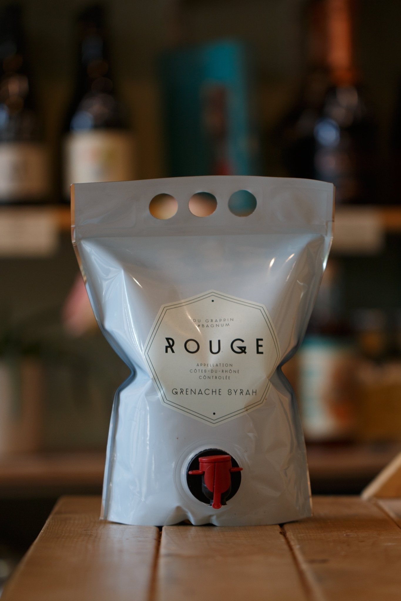 Bagnum Rouge Du Grappin 1.5L packaging, featuring a modern design for organic vegan Syrah and Grenache wine from the Rhône valley, ideal for casual drinking and food pairings.